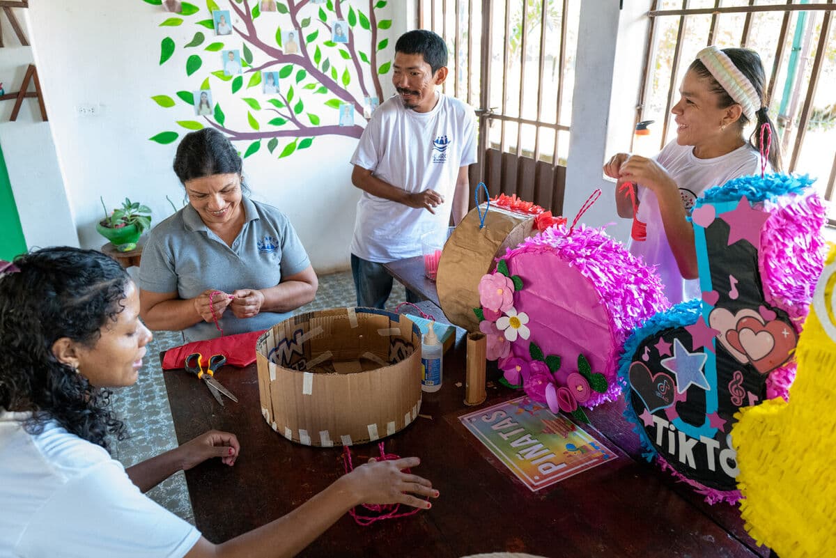 Workshop team making piñatas