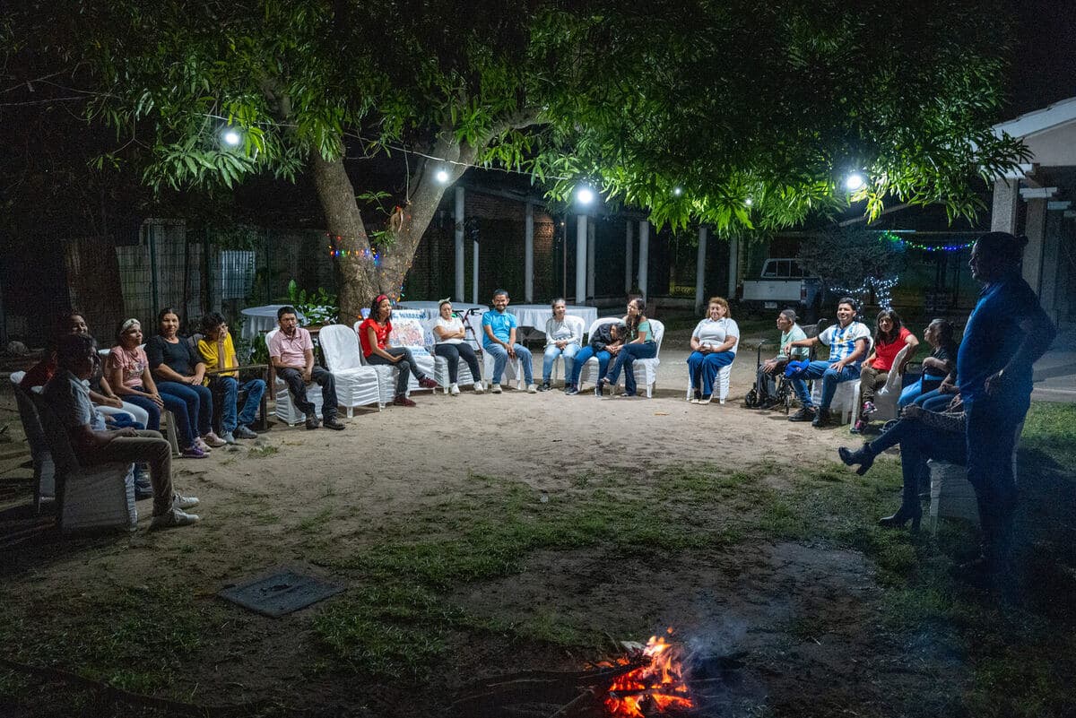 Community gathered around a bonfire